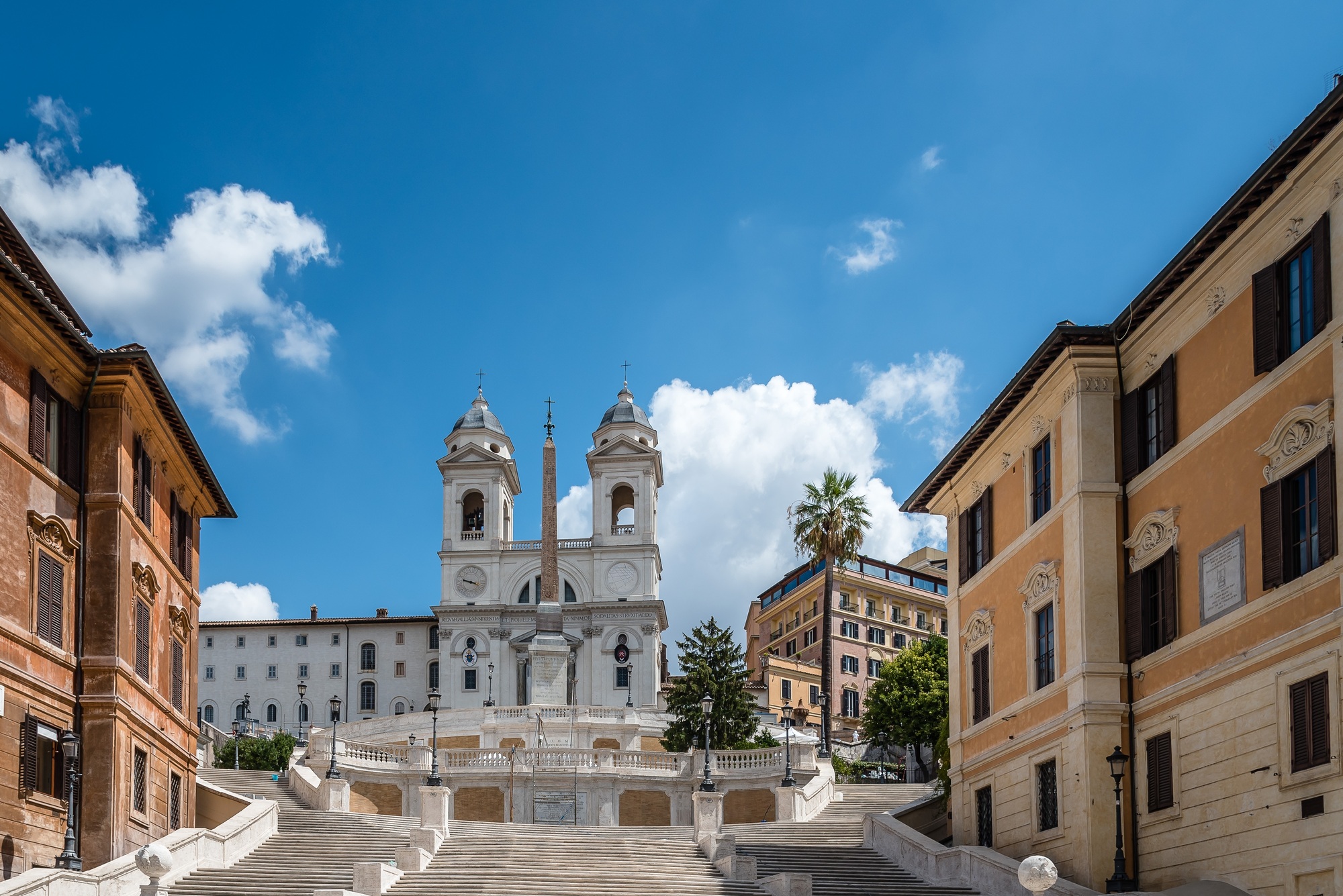 Piazza di Spagna and spanish steps to Piazza della Trinita dei Monti a sunny summer day